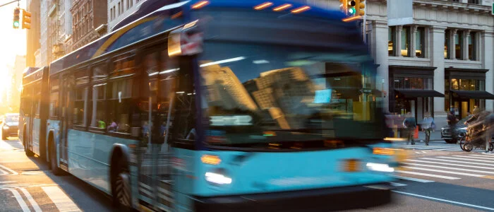 A bus speeds past on the street